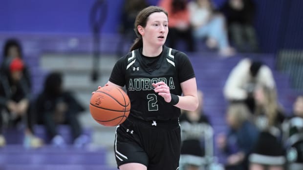 Aurora guard Sam Stask brings the ball up the floor in a game at Barberton on January 26, 2024.